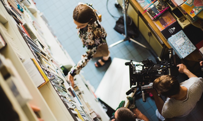 Woman recording video in shop